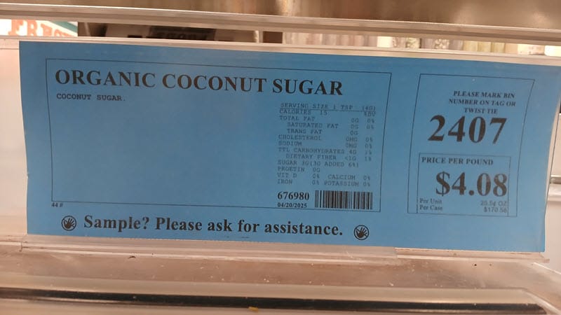 WinCo bulk-bin label for organic coconut sugar with nutrition info and a $4.08 per pound price