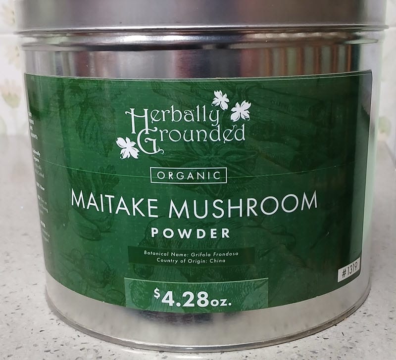 Herbally Grounded organic maitake mushroom powder in a metal tin