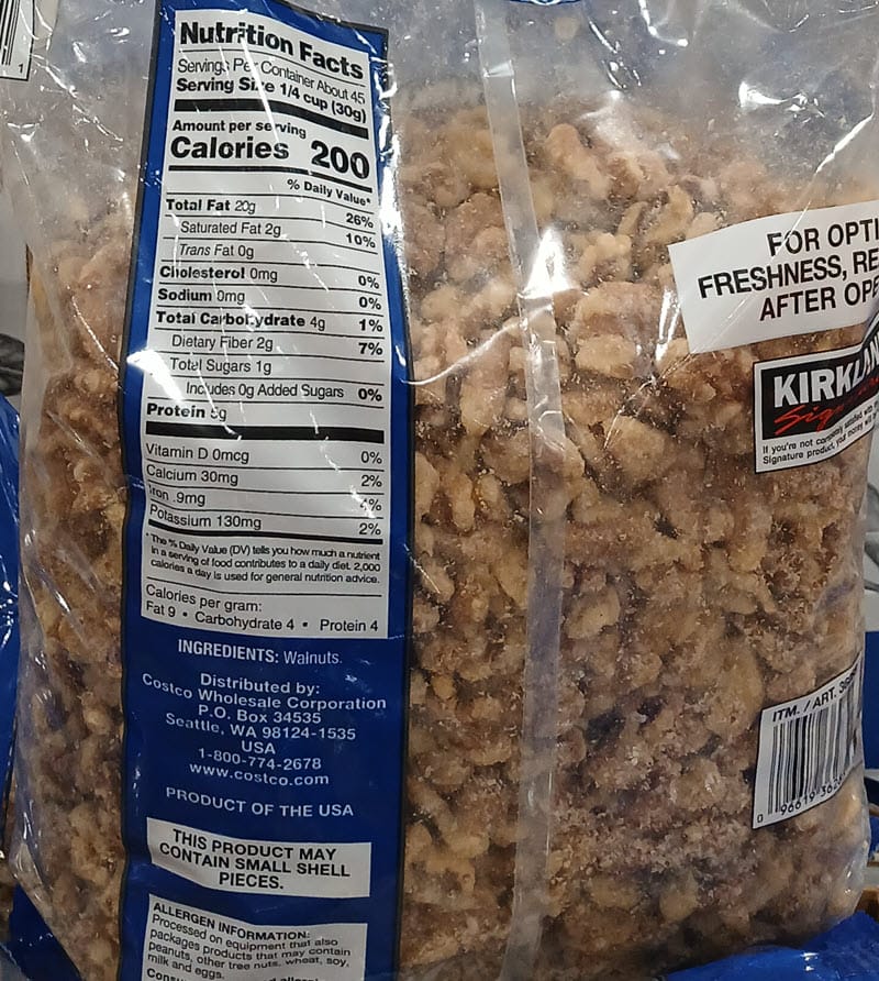 Back of a Kirkland Signature walnuts bag showing its Nutrition Facts and single walnut ingredient