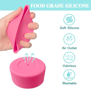 Pink silicone tumbler boot being squeezed to show its flexibility, with soft-silicone, air-outlet, odorless, and washable features