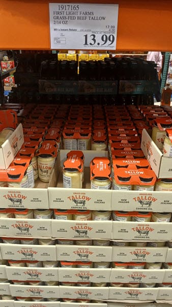 Costco display of First Light Farms grass-fed beef tallow with a $13.99 price sign