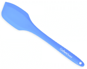 Blue silicone Crafter’s Choice spatula for stirring soap batter