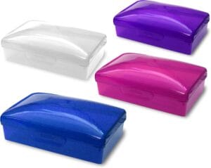 Four hinged plastic travel soap boxes in clear, purple, pink, and blue