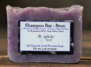 Soaplicity purple ‘Shampoo Bar - Brun’ all-natural cold-process soap with its wrapped label