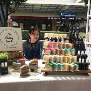 The Daily Soak handmade-soap booth display at an outdoor market