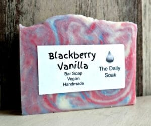 The Daily Soak ‘Blackberry Vanilla’ handmade vegan bar soap with its printed label